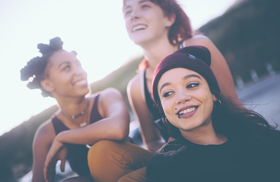 Mixed race group of grunge girls hanging out together Photograph by Wundervisuals