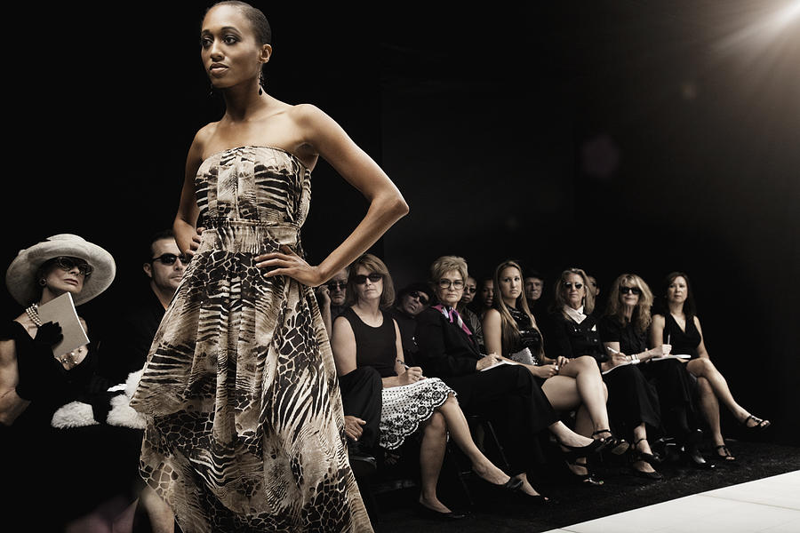 Mixed race model on runway in fashion show Photograph by Hill Street Studios