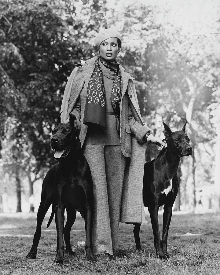 Model Beverly Johnson With Two Great Danes Photograph by Francesco Scavullo