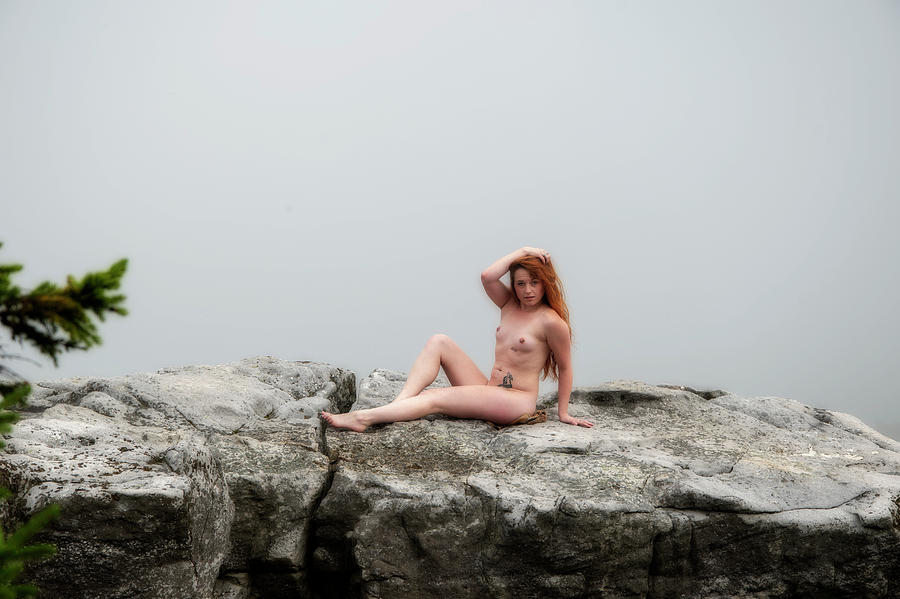 Model on rocks outdoors in the fog posing nude and topless 29 Photograph by Daniel Friend
