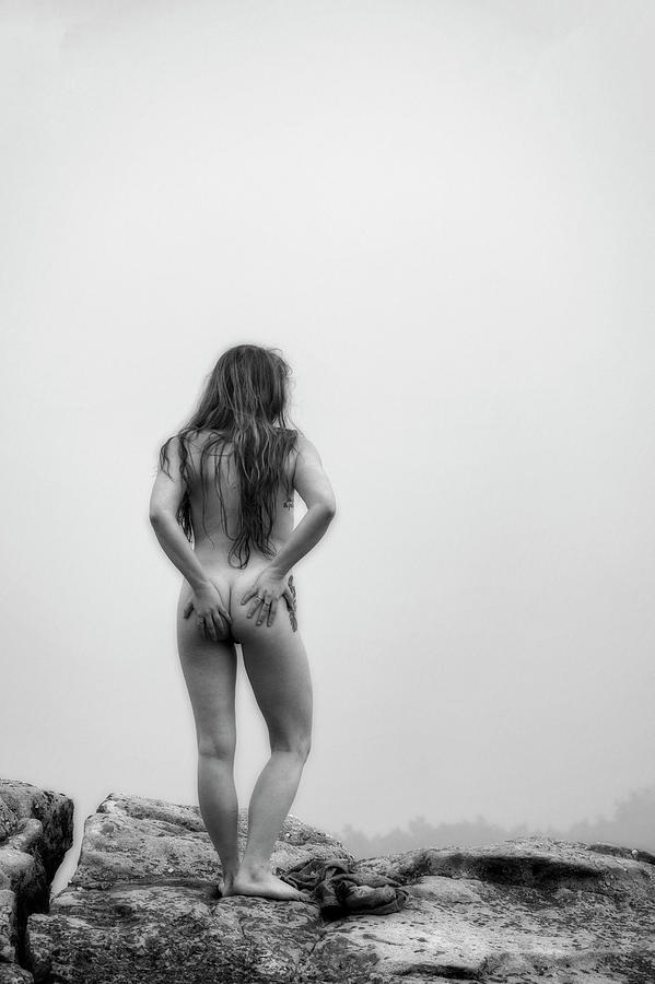 Model on rocks outdoors in the fog posing nude and topless 40 Photograph by Daniel Friend