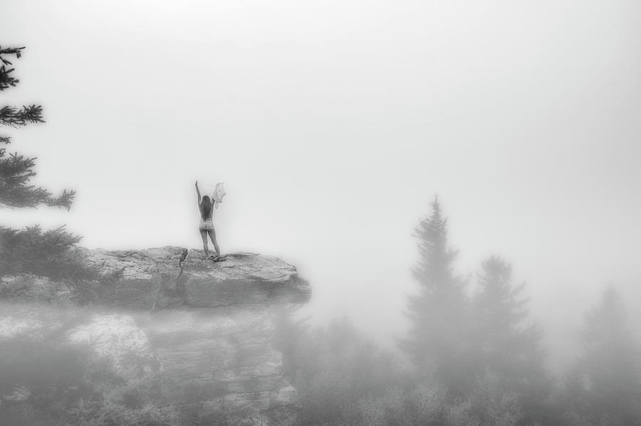 Model On Rocks Outdoors In The Fog Posing Nude And Topless
