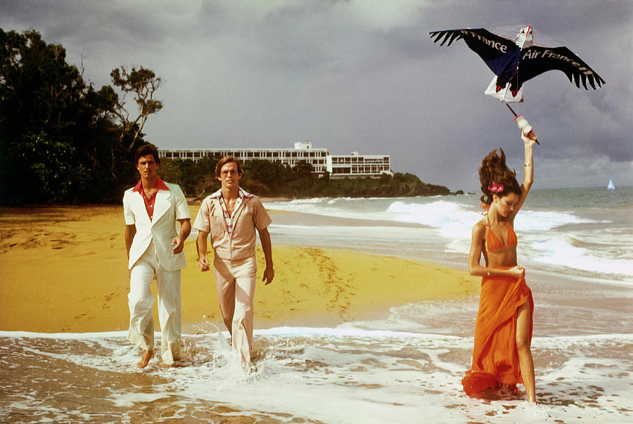 Models Walking On The Beach Photograph by Barry McKinley