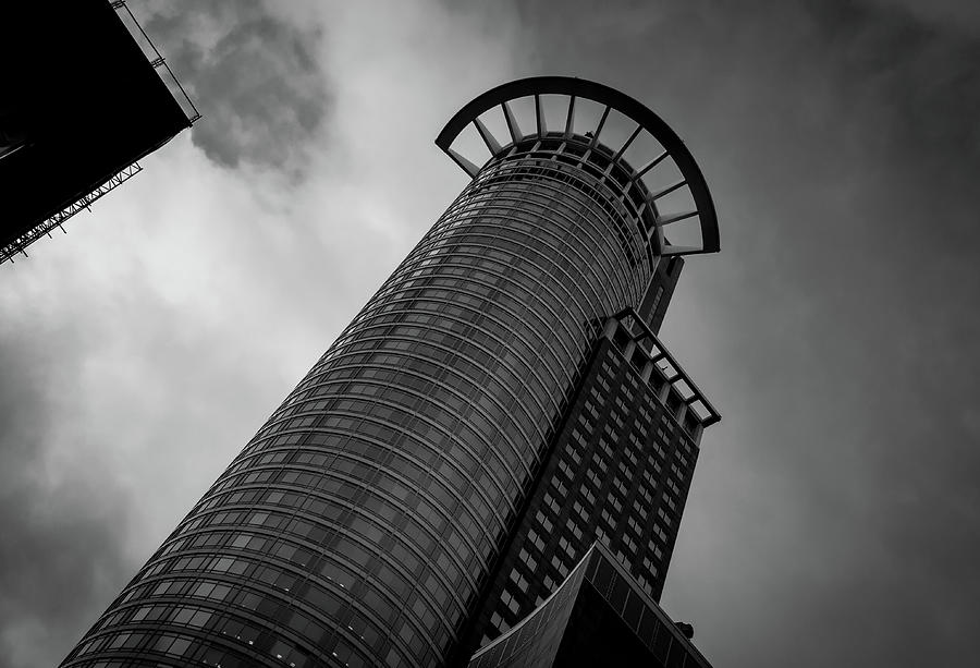 Modern architecture design of a Skyscraper building. Black and white futuristic exterior against cloudy sky Photograph by Michalakis Ppalis