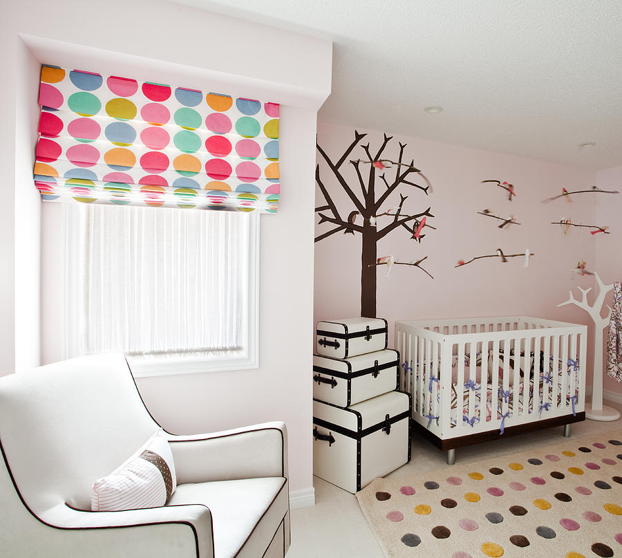 Modern baby nursery with polka dots and trees Photograph by Jgareri