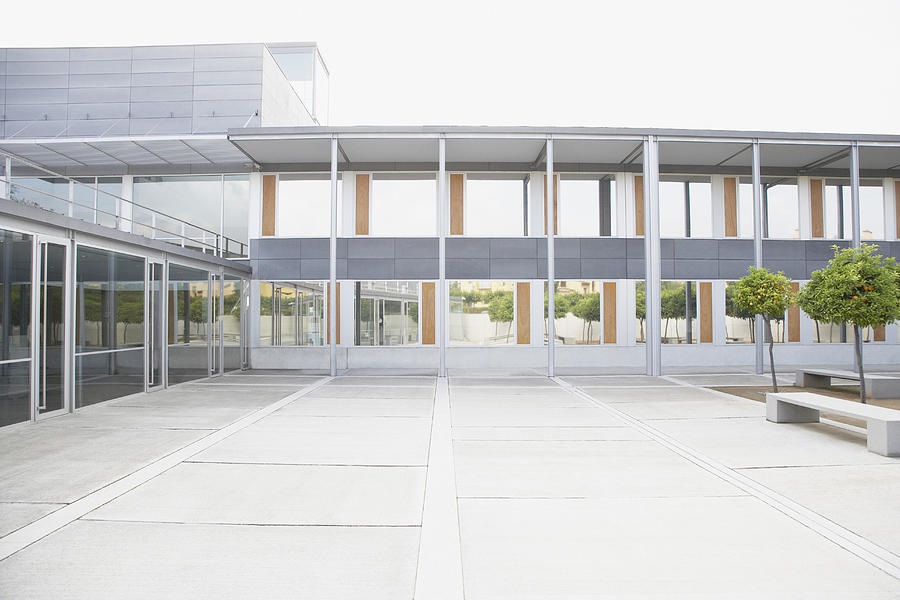 Modern courtyard and office building Photograph by Tom Merton