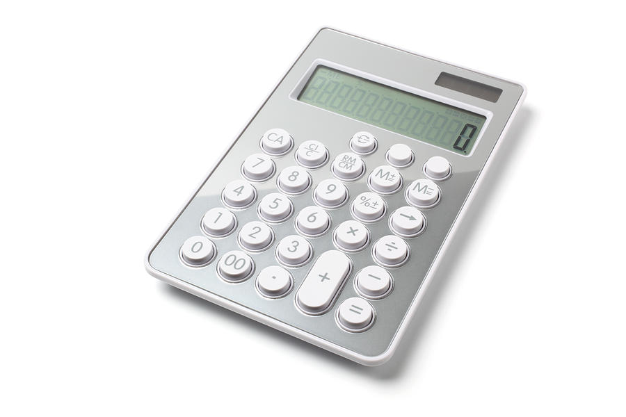Modern gray calculator on white background Photograph by Blackred