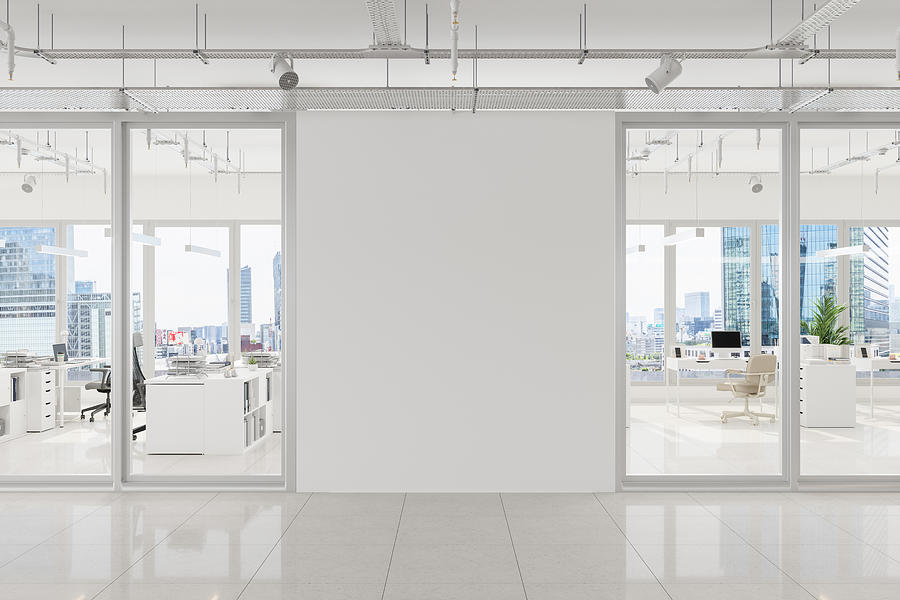 Modern Open Plan Office With White Blank Wall And Cityscape Background Photograph by Onurdongel