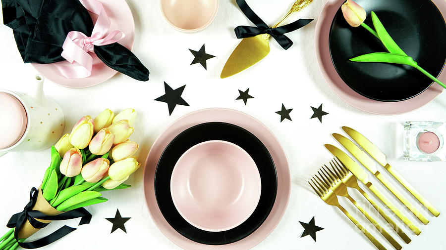 Modern pink, black and gold table place setting top view flat lay. Photograph by Milleflore Images