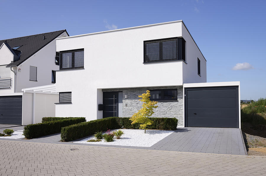 Modern white house with garage Photograph by Acilo
