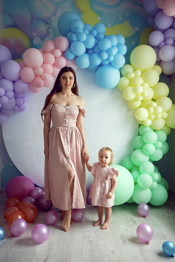 Mom And Daughter In Pink Dresses Stand On A White Background Photograph 