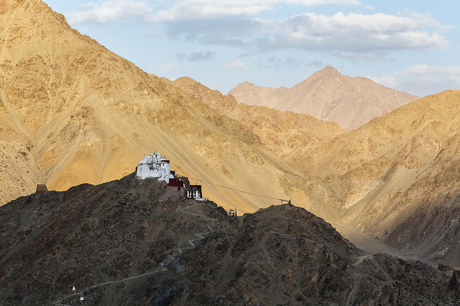 Monastery on rocky hilltop in remote mountain valley, Leh, Ladakh, India Photograph by Jeremy Woodhouse