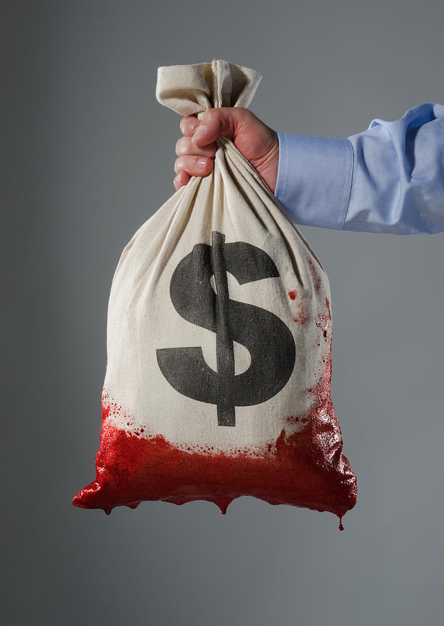 Money bag dipped in blood Photograph by PM Images