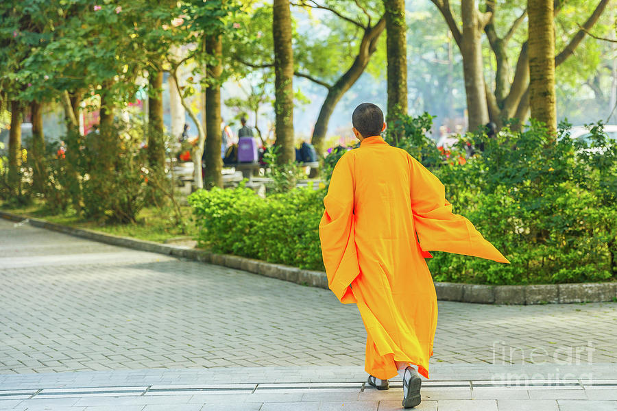 Monk In Orange Running Photograph by Benny Marty