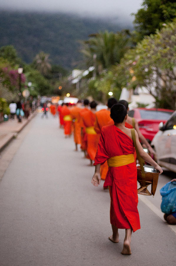 Monks collecting alms from citizens, Luang Prabang, Laos Photograph by Cultura Exclusive/Samantha Mitchell