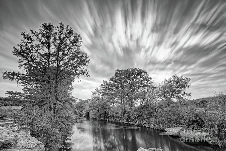 Monochrome Long Exposure of Onion Creek and Streaking Clouds - McKinney Falls State Park - Austin TX Photograph by Silvio Ligutti