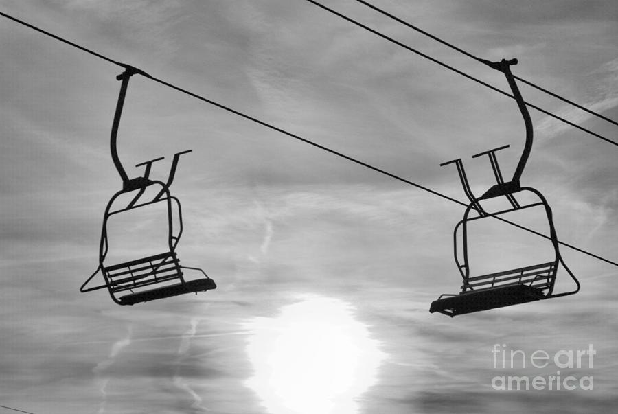 Montage Ski Chairs Over The Fiery Sun Black And White Photograph by Adam Jewell