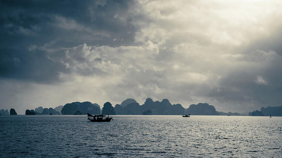 Moody morning in Ha Long Bay Photograph by Alexey Stiop