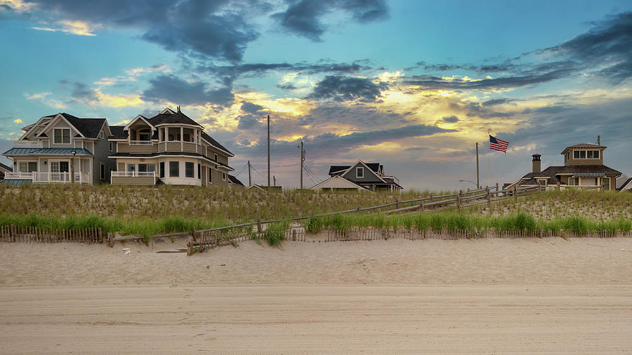 Moody Skies Behind the Beach Houses Photograph by Matthew DeGrushe