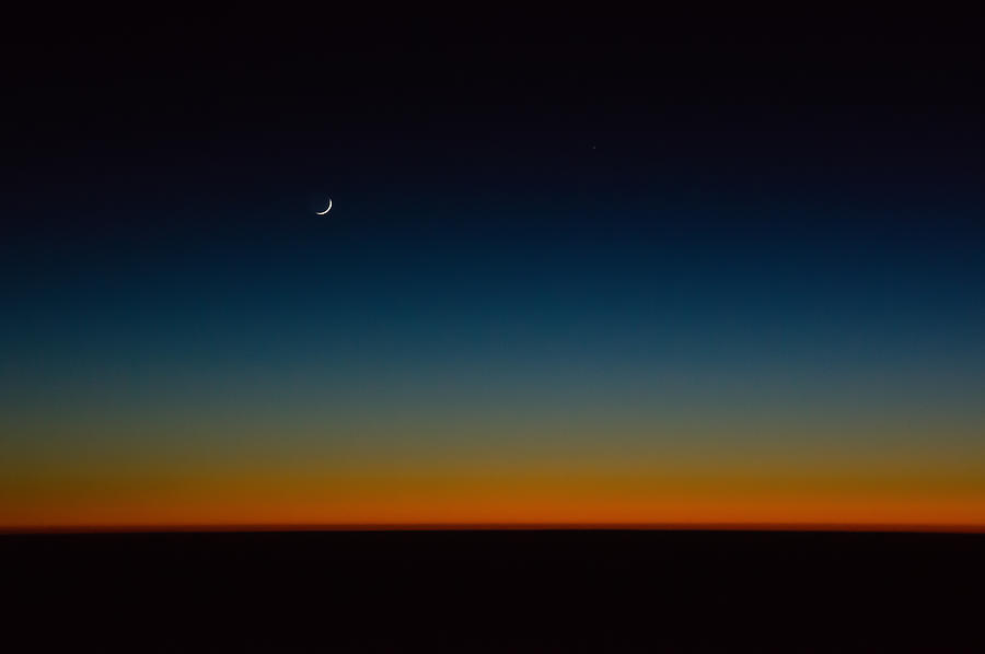 Moon after sunset Photograph by Michael Phillips