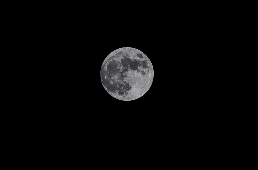 Moon in the dark sky Photograph by Hyuntae Kim
