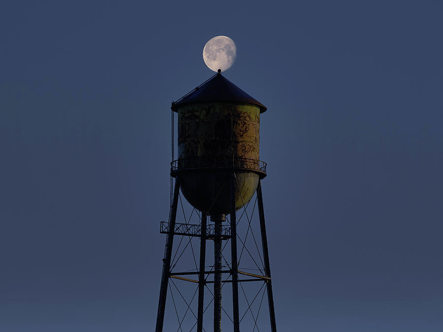 the moon comes over the tower