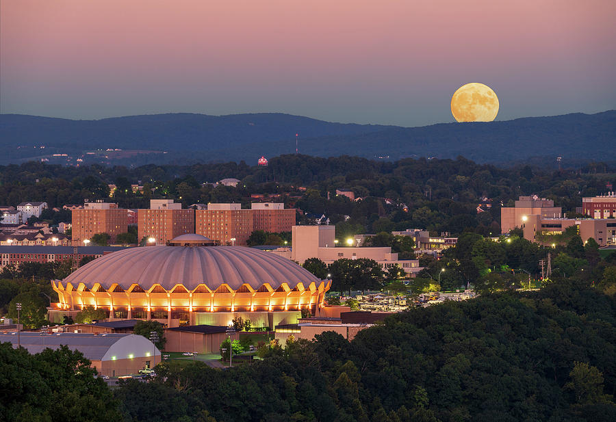 Moon rising above the Coliseum at WVU Photograph by Steven Heap