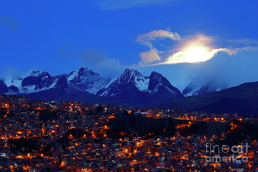 City Photograph - Moon rising through clouds above the Andes Mountains La Paz Bolivia by James Brunker