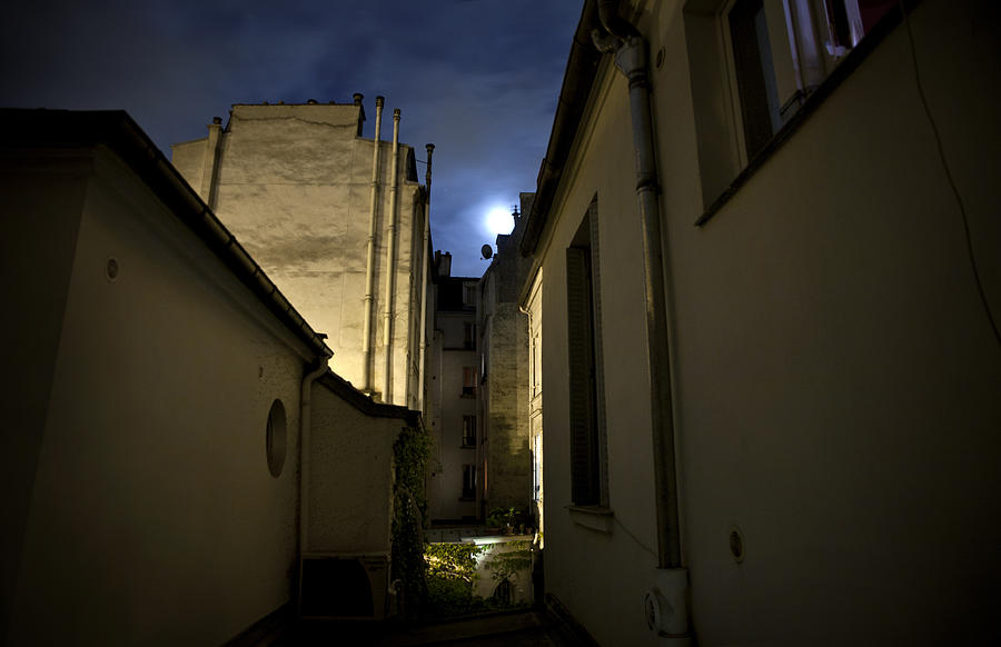 Moonlight in the sky between old buildings, Paris, France Photograph by Busà Photography