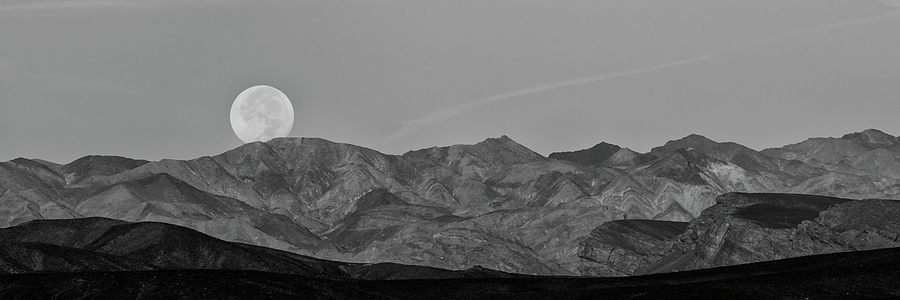 Moonset Over Death Valley - Black and White Photograph by Loree Johnson