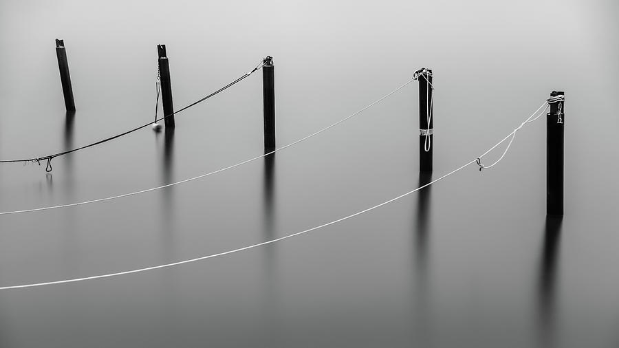 Black And White Photograph - Mooring Poles in Black and White by Nicklas Gustafsson