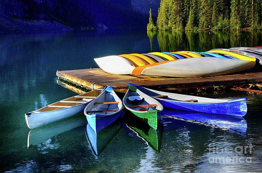 Moraine Lake Canoes Photograph by Bob Christopher