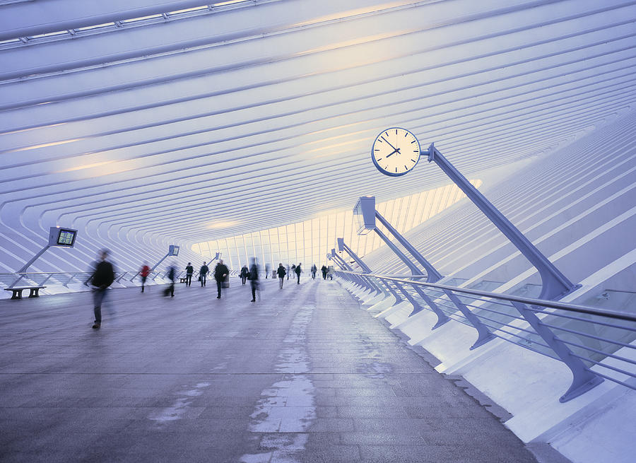 Morning commute at a futuristic train station. Photograph by EschCollection