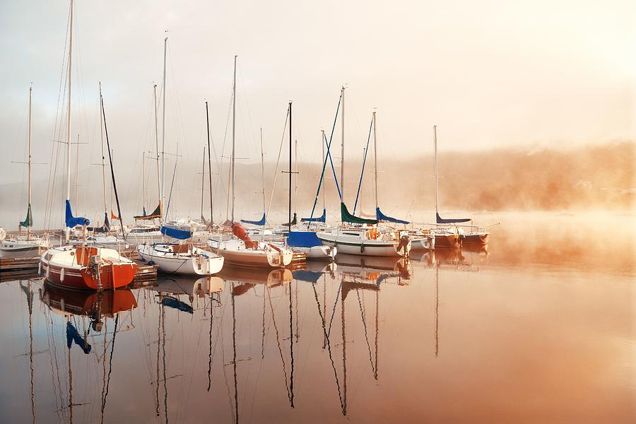 Morning foggy lake boat sunrise Photograph by Songquan Deng
