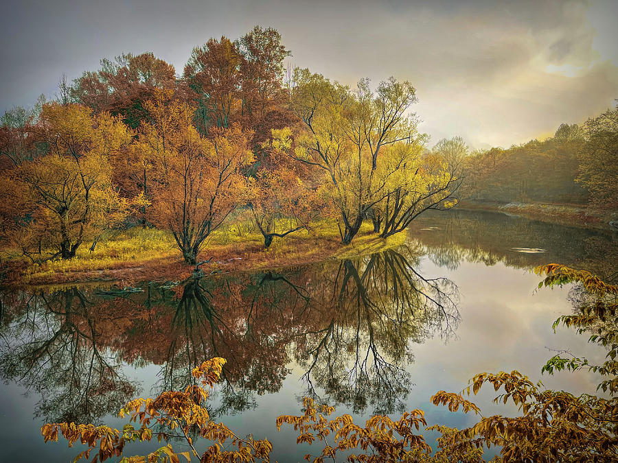 Morning Reflections on the Autumn River Photograph by Debra and Dave Vanderlaan