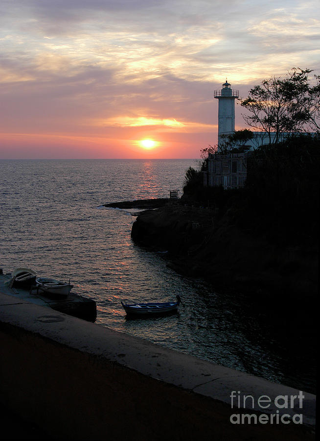 Morning sunrise over the lighthouse on the Island of Ventotene, Italy  Photograph by Gunther Allen