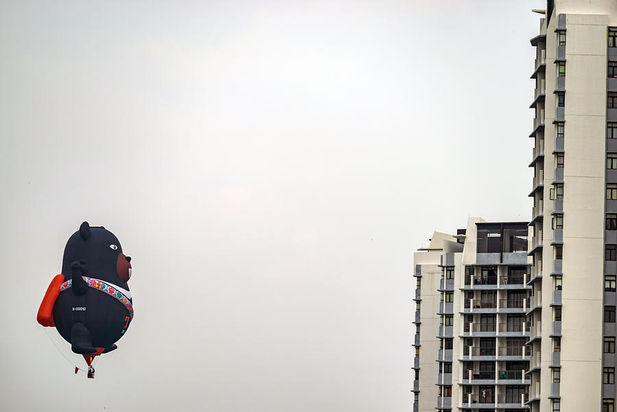 Morning view with hot balloons over condominium at Putrajaya. Photograph by Shaifulzamri