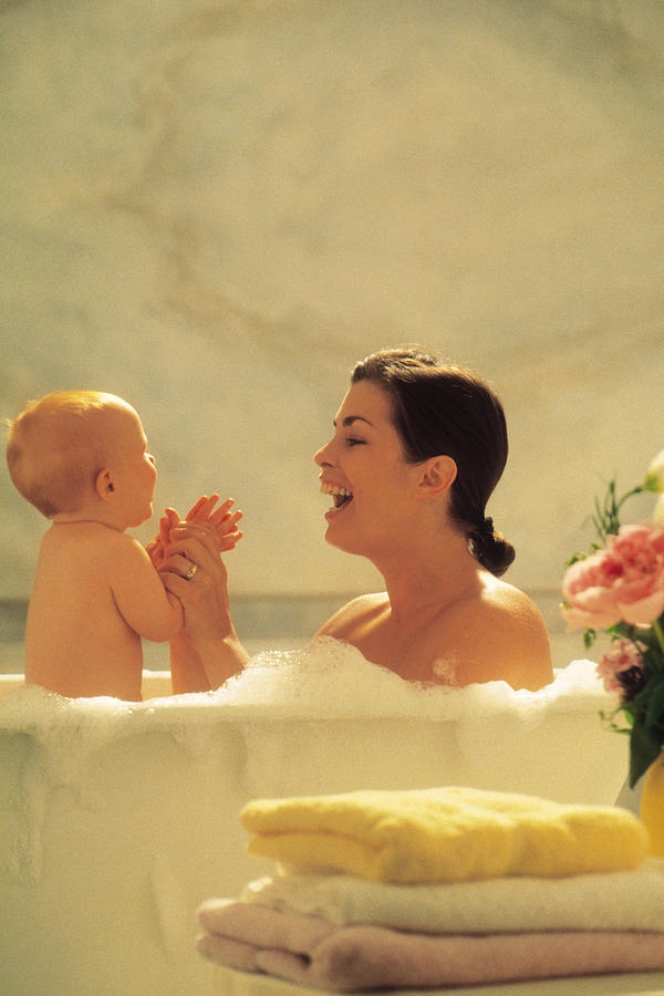 Mother and baby taking a bath Photograph by Comstock
