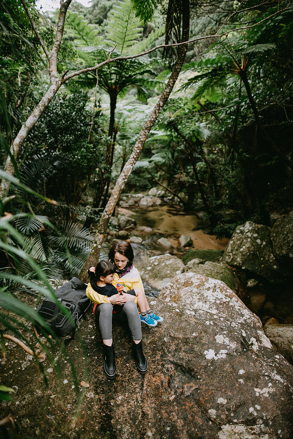 Mother and child having intimate moment in jungle, Okinawa, Japan Photograph by Ippei Naoi
