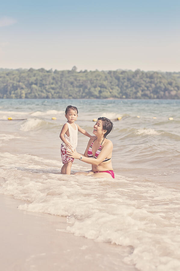 Mother and child on the beach Photograph by Gilbert Rondilla Photography