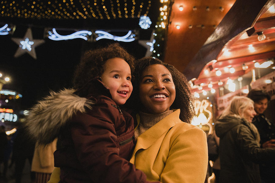 Mother and Daughter at Christmas Markets Photograph by SolStock