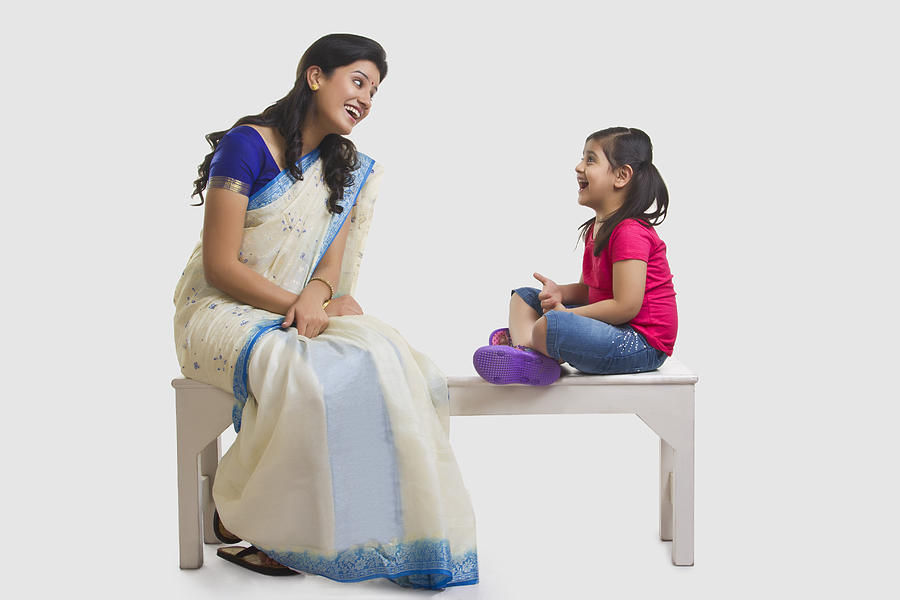 Mother and daughter having a laugh Photograph by IndiaPix/IndiaPicture