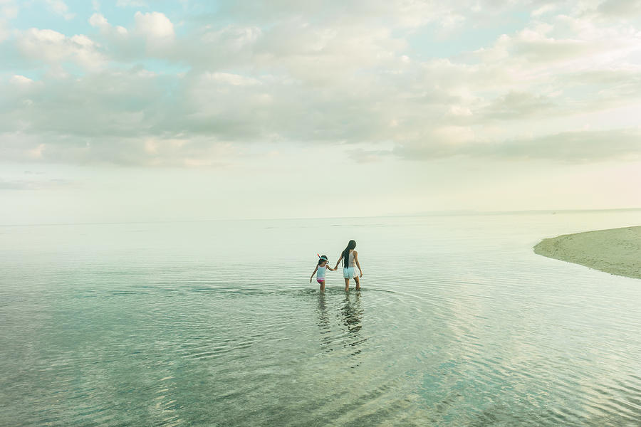 Mother and daughter in water Photograph by Carlo A