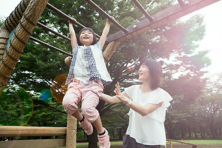 Mother and daughter playing in the park Photograph by Taiyou Nomachi