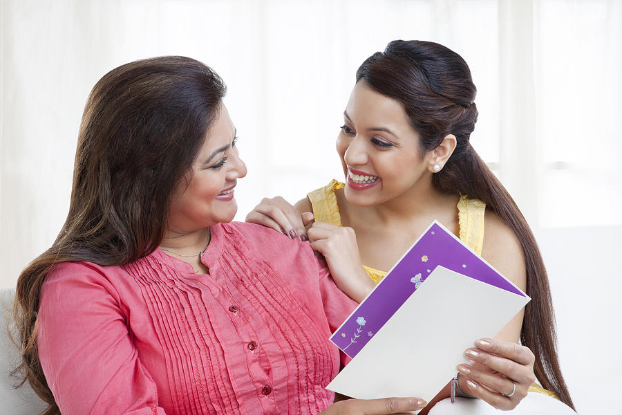Mother and daughter with greeting card Photograph by Ravi Ranjan