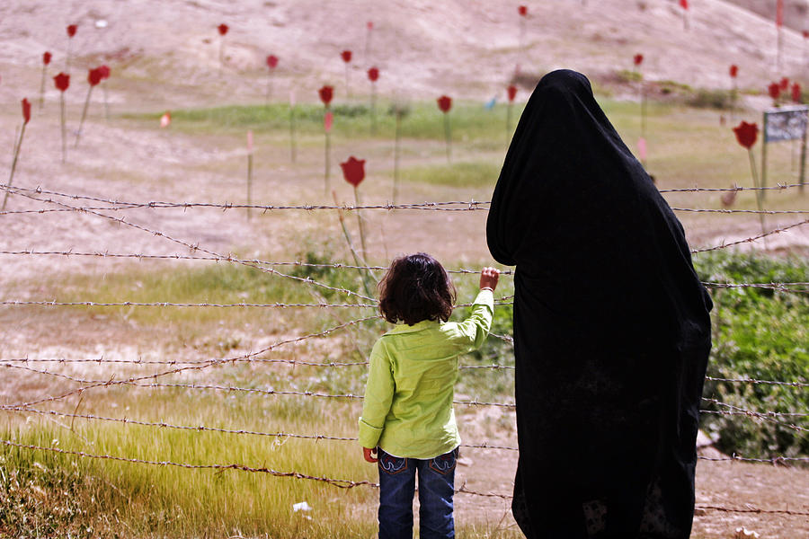 mother and her daughter are visiting the place which Iran Iraq war happend there Photograph by Mansoreh  Motamedi