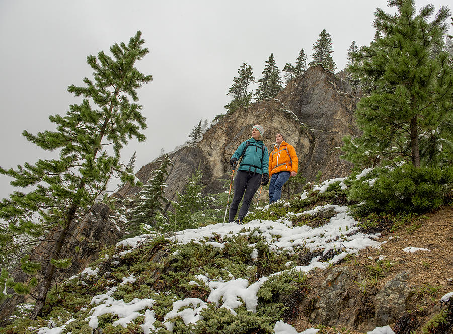 Mother and son hike on snowy mountainside Photograph by Ascent Xmedia