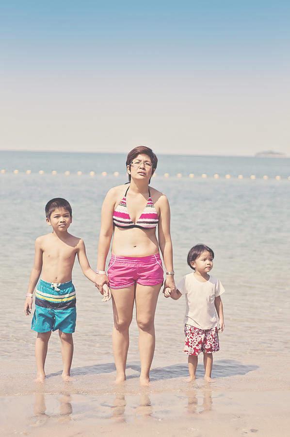Mother and two kids on the beach, looking bored Photograph by Gilbert Rondilla Photography