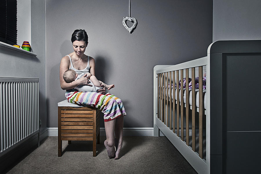 Mother cradling baby Photograph by Justin Paget