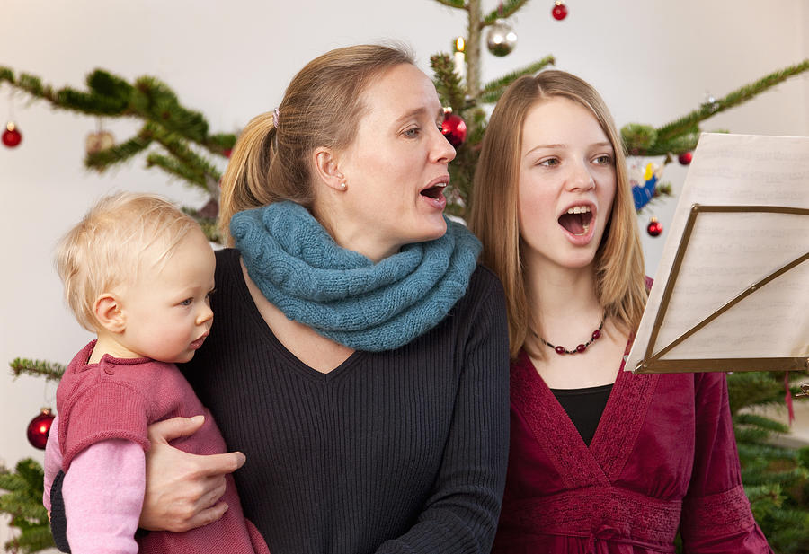 Mother, Daughter, Baby Singing Carols Photograph by Henglein and Steets